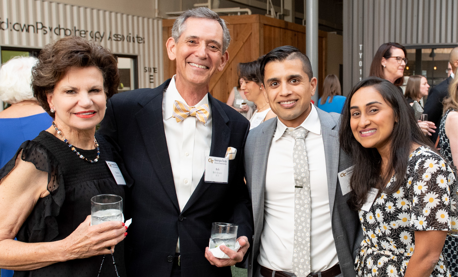 Group of well-dressed alumni at event