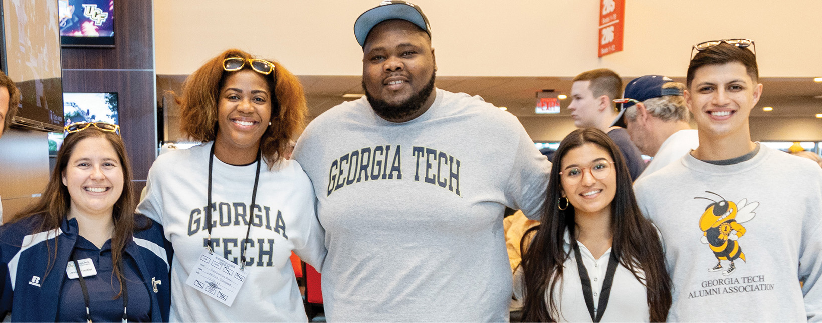 Group of alumni at a game watching event