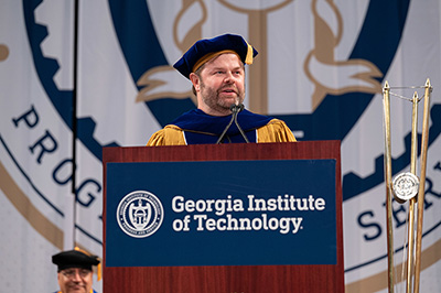 Chris Klaus speaking on stage