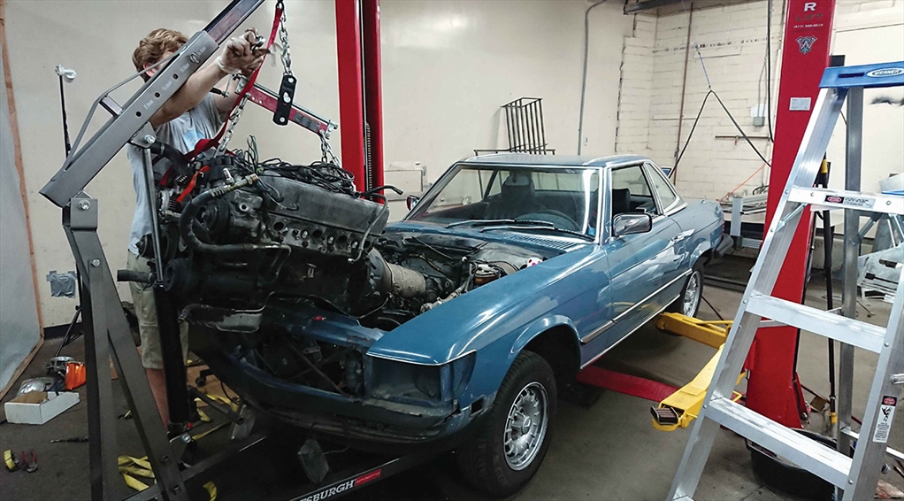 A car being worked on by a mechanic