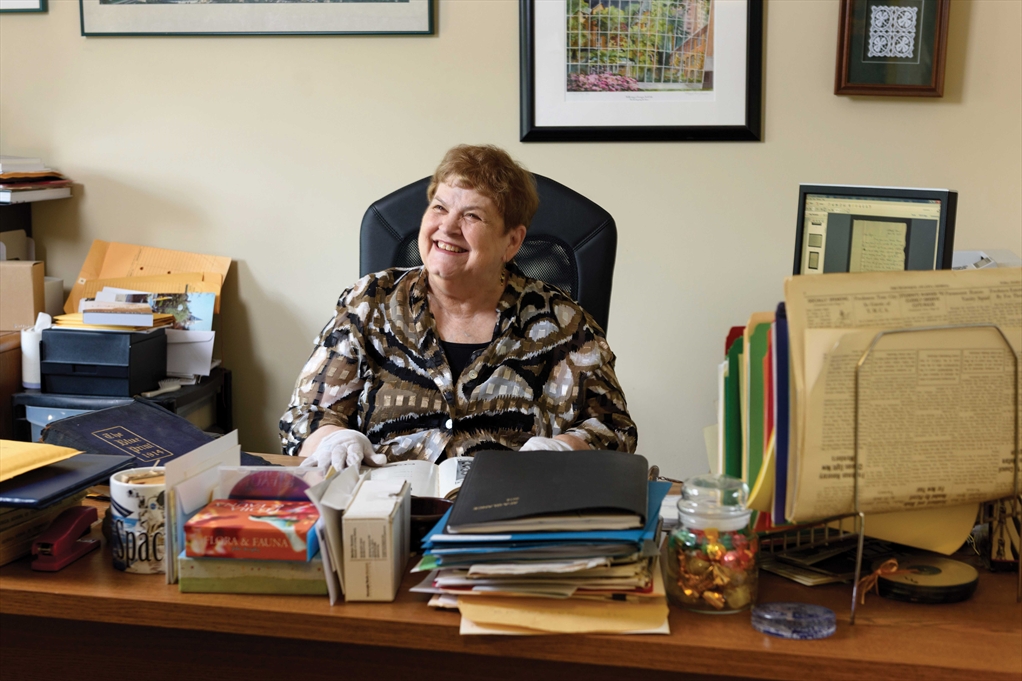 Marilyn Somers sitting at her desk